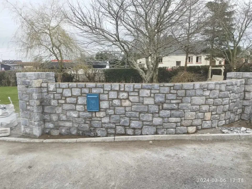 Sandstone retaining wall built into a Canberra garden